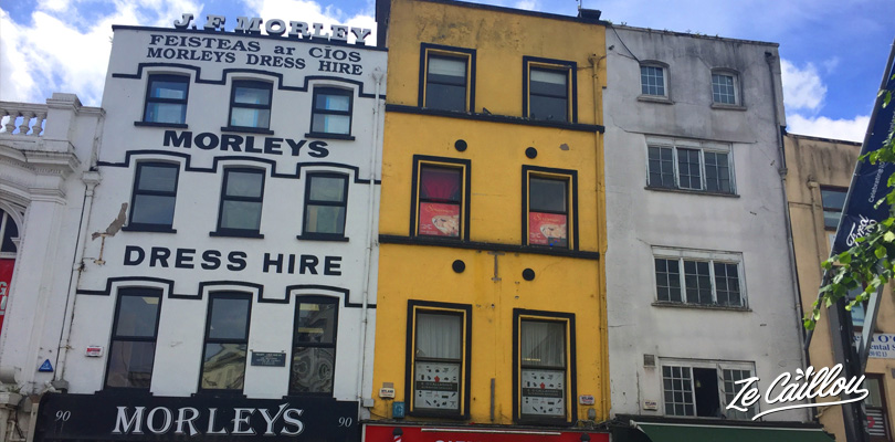 Colorful town with many buildings, restaurants, pubs and shops in Cork