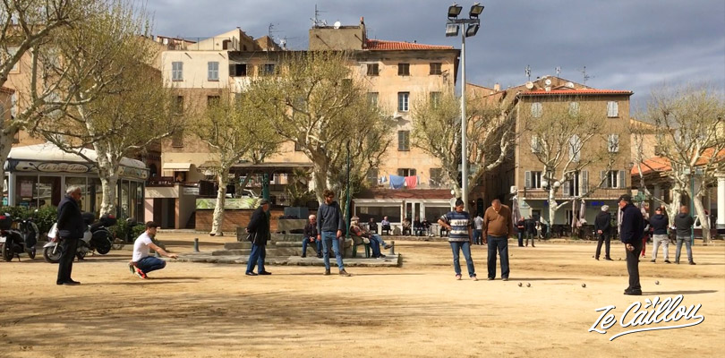 Local people from Corsica playing petanque in a small town.