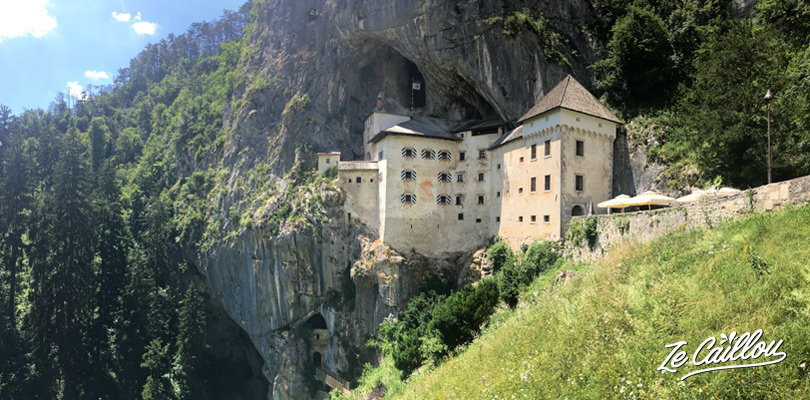 Discover the Predjama castle during your roadtrip in Slovenia with a van.