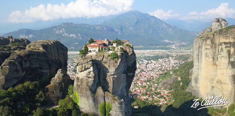 Triada monastery in the Meteora site in Greece with a van.