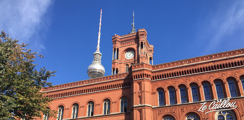 The red bricks town hall in the Mitte district of Berlin with a van.