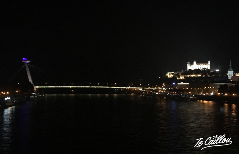 Night view on Bratislava old town, ufo bridge and the castle in Slovakia by van.