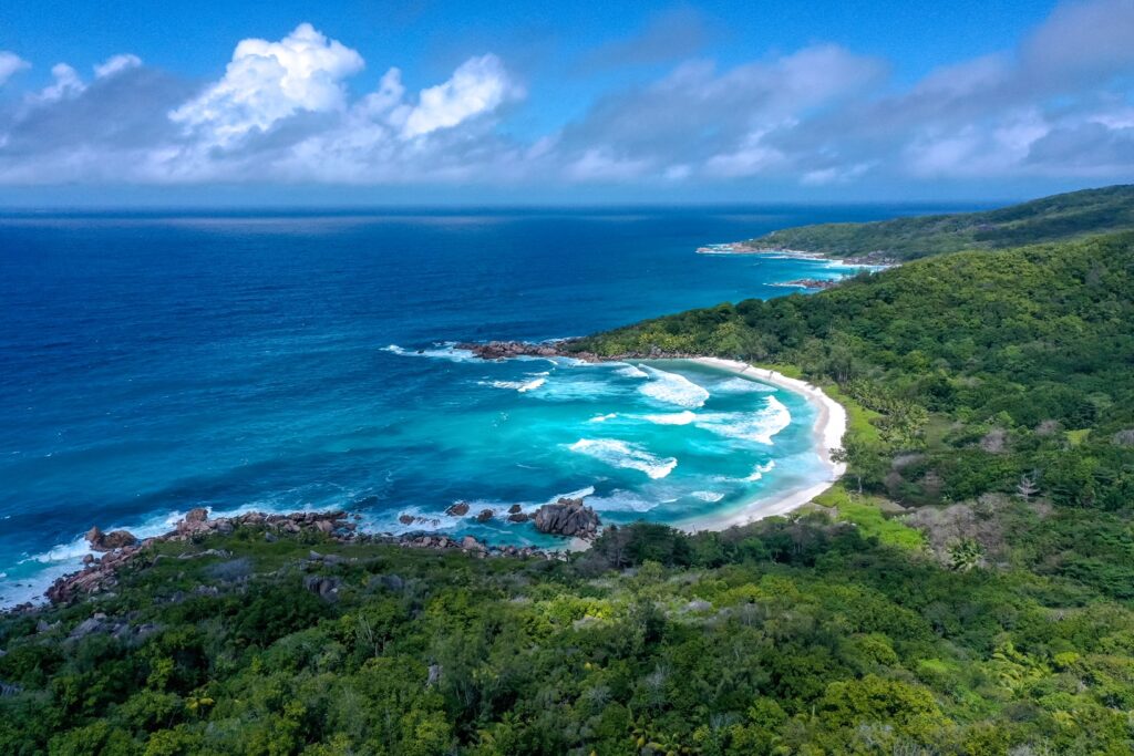 Bay of Anse Coco seen by drone during the hike towards Anse Caiman in La Digue.