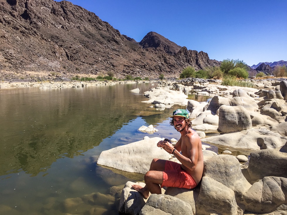 Romain takes the opportunity to fish in the Orange River in Namibia.