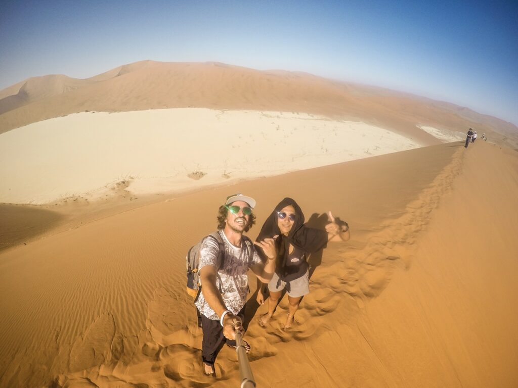 Romain and Nina climbing the Big Daddy dune in Sossusvlei in Namibia.